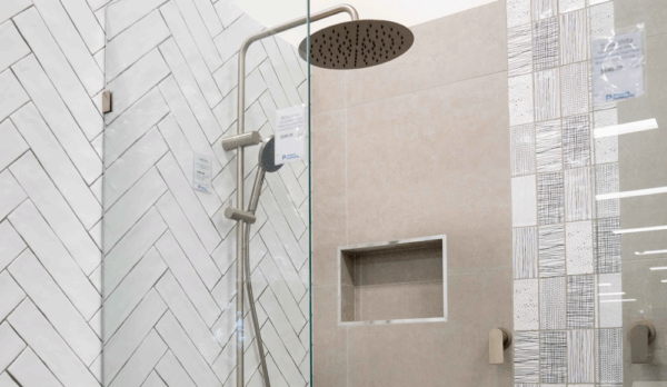 Jones Plumbing Plus’s showroom displays a variety of shower styles – from sleek rain heads to convenient dual rail setups – helping customers visualise their new bathroom.